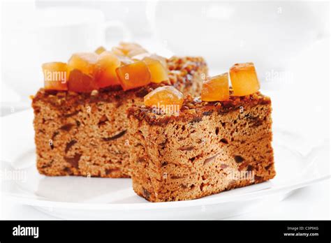 Ginger cake with candied ginger in plate Stock Photo - Alamy