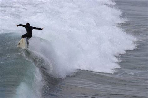 Surfing at Huntington Beach Pier by gloria085 - VIEWBUG.com