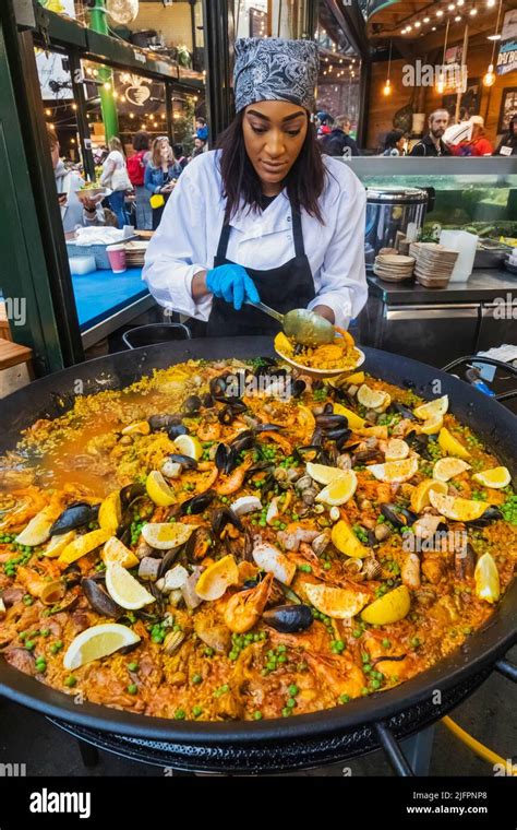 Borough Market, Woman Cooking Giant Paella, Southwark, London, England ...