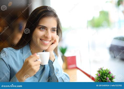 Happy Woman Drinking Coffee in a Bar Looking Away Stock Photo - Image ...