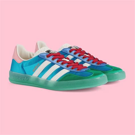 Shop the adidas x Gucci women's Gazelle sneaker in blue at GUCCI.COM. Enjoy Free Shipping and ...