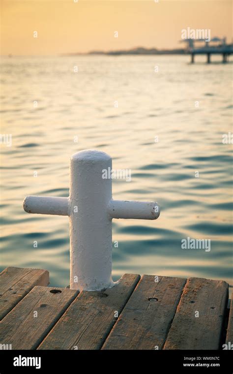 Wooden pier at sunset Stock Photo - Alamy