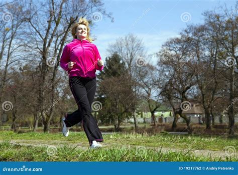 Woman Jogging In The Park Stock Photography - Image: 19217762