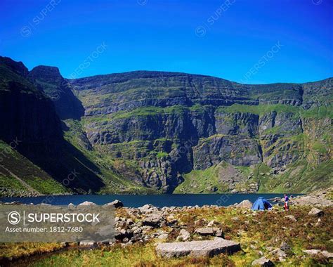 Co Waterford, Ireland, People camping by the Comeragh Mountains and ...