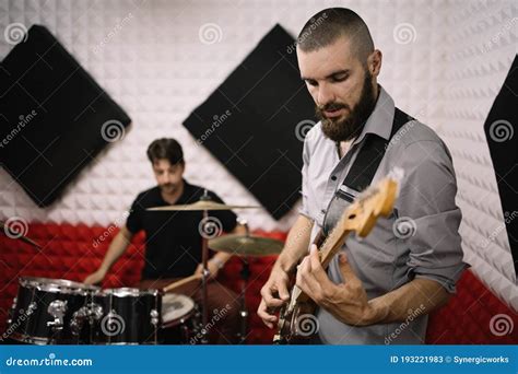 Band Members Playing Electric Guitar and Drums Stock Image - Image of people, playing: 193221983