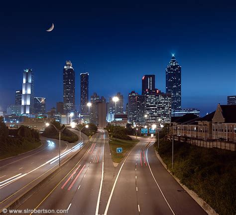 Photo of Atlanta skyline at night with highway, light streaks from ...