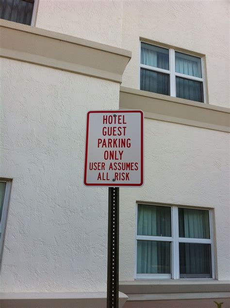 This really should have been two signs. It is in a hotel parking lot ...