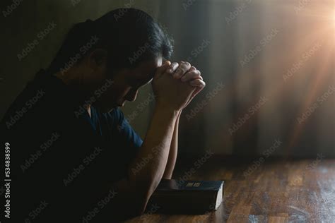 Prayer person hand in black background. Christian catholic woman are ...