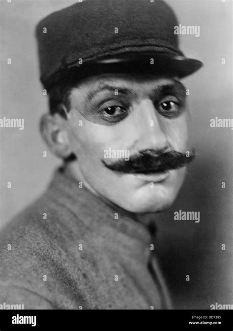 World War 1. French soldier, whose face was disfigured in World War I, wearing a mask of ...