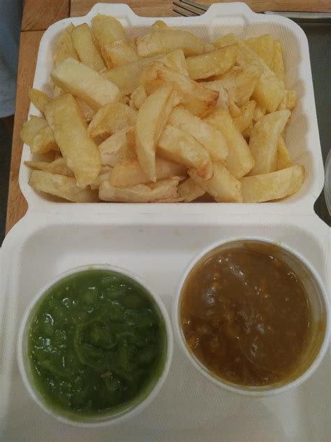 True British chips loaded with salt and vinegar, side of curry sauce ...