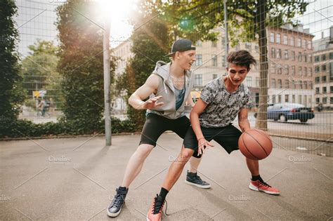 Teenagers playing basketball | High-Quality Sports Stock Photos ~ Creative Market