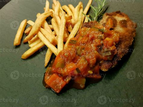 breaded wiener schnitzel with side dishes 24056126 Stock Photo at Vecteezy