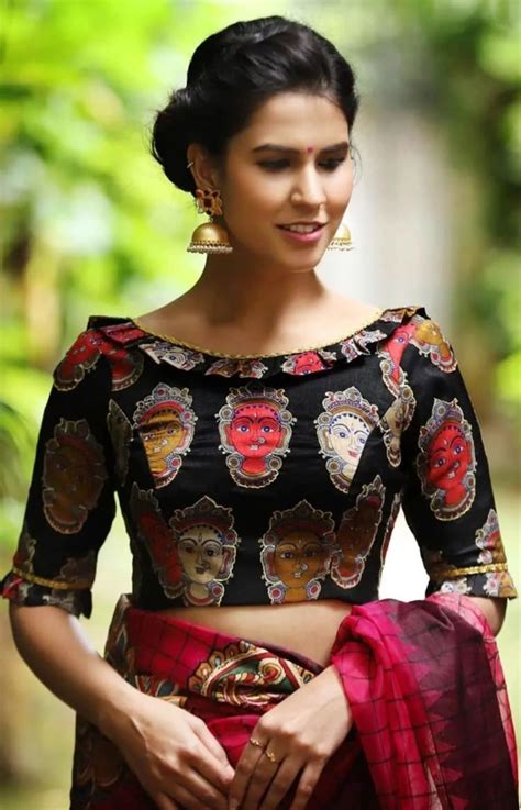 Wedding Blouse Designs - Black boat neck blouse with artistic face-kind print | Unique blouse ...