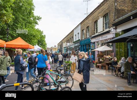 People out and about at the Sunday flower market in Columbia Road ...