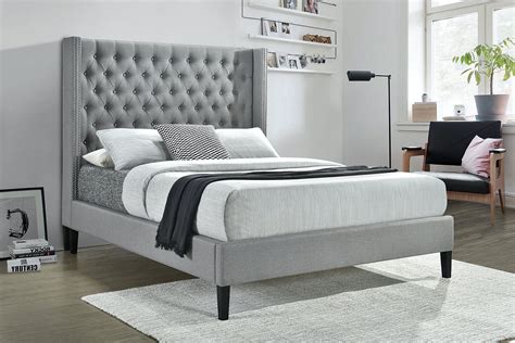 grey upholstered bed