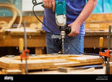 Carpenter using drill Stock Photo - Alamy