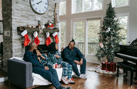 Happy black family enjoying Christmas holidays at home · Free Stock Photo