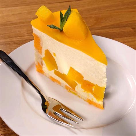 Learn how to make this Mango Mousse Cake! Stunning cake made of a moist sponge cake topped with ...