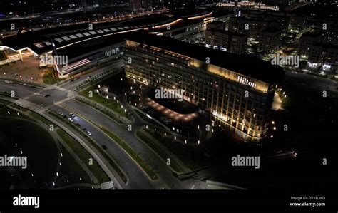 An aerial view of modern buildings of Abu Dhabi plaza complex at night ...