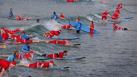 More than 300 surfing Santas broke the Guinness World Record for the ...