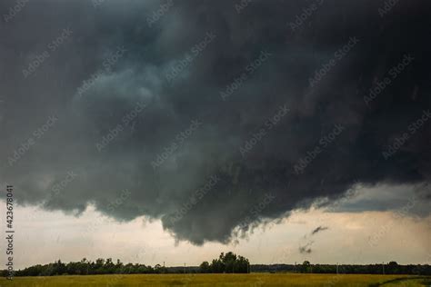 Supercell storm clouds with wall cloud and intense rain Stock Photo ...