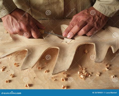 Carving a leaf in wood stock image. Image of skill, woodwork - 26789051