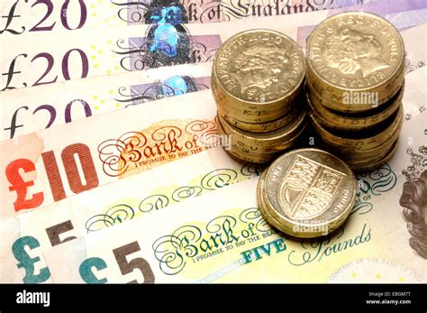 British currency - pound coins and notes Stock Photo - Alamy