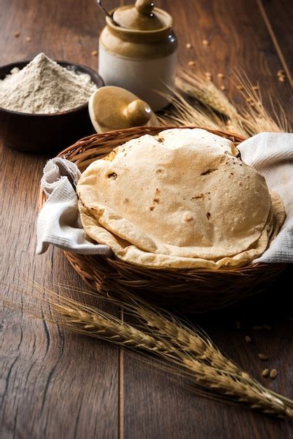 Premium Photo | Indian Chapati or Fulka or Gehu Roti with wheat grains ...