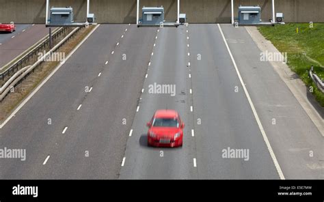 Gatso speed cameras on all lanes of the M1 motorway on the gantry in a variable speed limit area ...