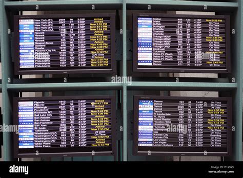 airport arrival and departure schedule board Stock Photo - Alamy