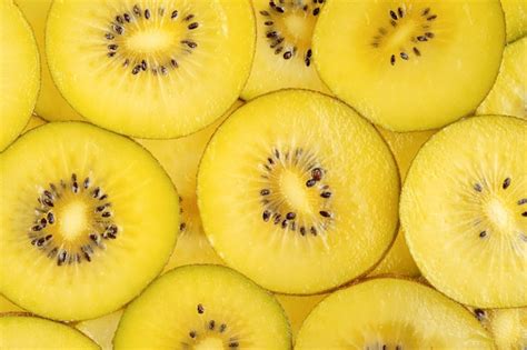 Premium Photo | Yellow kiwi fruit pattern healthy food background overhead