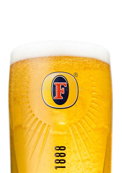 LONDON,UK - AUGUST 10,2022: Original Glass of Fosters Lager Beer with Foam and Logo on White ...