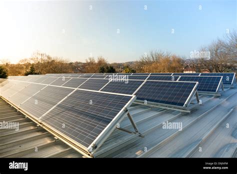 Photovoltaic solar panels on a factory roof Stock Photo - Alamy