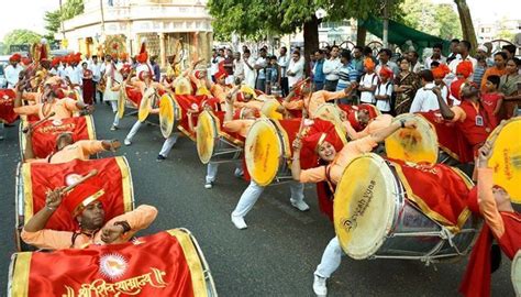 dhol tasha group at ganapati visarjan ....girls beating dhols along ...