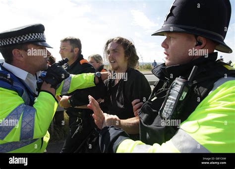 Camp for Climate Action. Police officers with environmental protesters close to Kingsnorth power ...