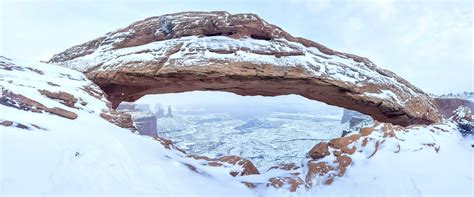 Mesa Arch while still snowing, Utah. [OC][6196 x 2582] : r/EarthPorn