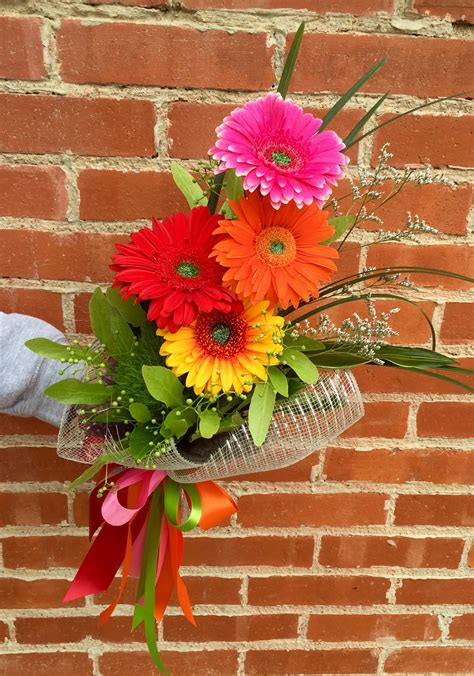 Gerberas wrapped for presentation bouquet in Pratt, KS | The Flower Shoppe