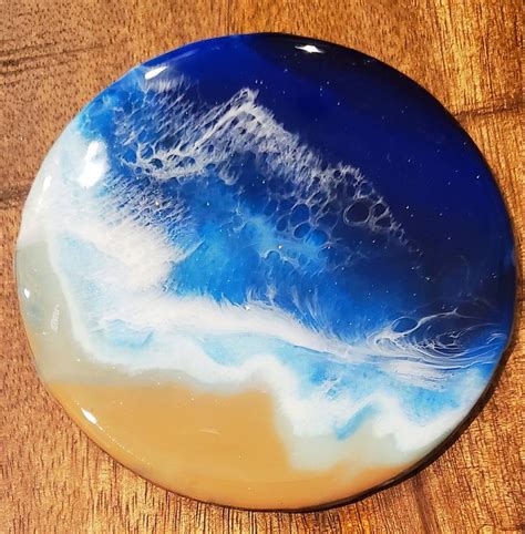 a blue and white plate sitting on top of a wooden table