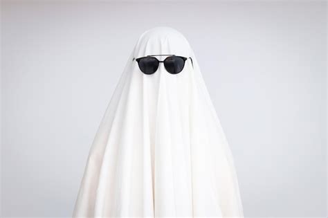 Premium Photo | Concept of halloween ghost with sunglasses on light ...