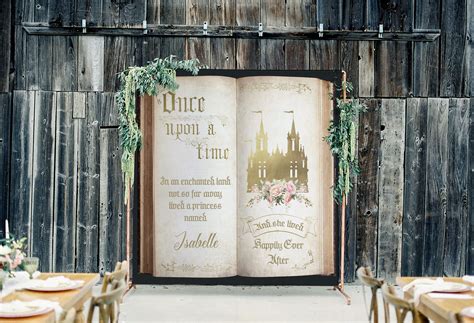 "This beautiful storybook backdrop with a vintage gold castle and pink flowers is an elegant way ...