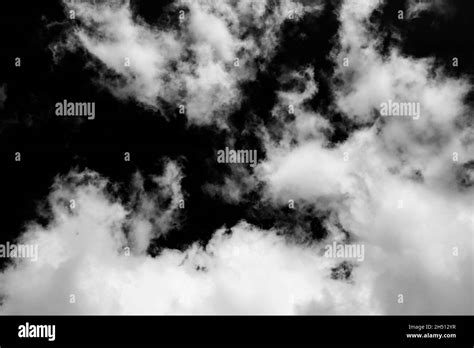 Beautiful smoke wallpaper. White clouds isolated on black background Stock Photo - Alamy