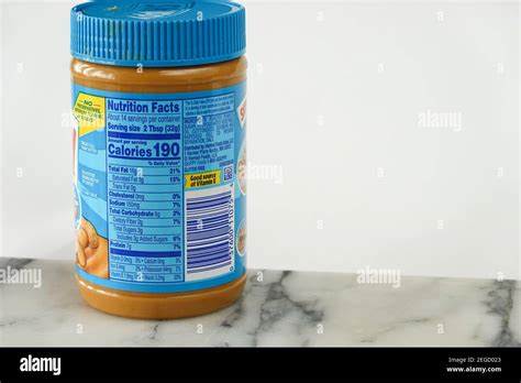 Peanut butter nutrition facts, ingredients and calories label on a jar ...