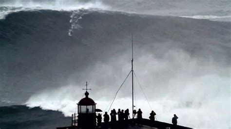 transpress nz: giant wave surfing off Nazaré lighthouse, Portugal