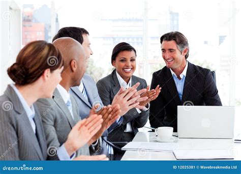 Happy Business People Clapping In A Meeting Stock Image - Image: 12025381