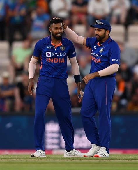 Hardik Pandya gets a pat from Rohit Sharma during his T20I best bowling performance ...