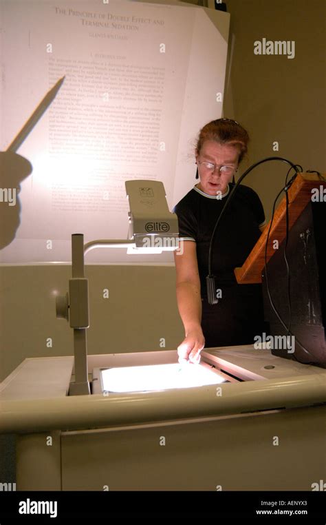 Woman using an overhead projector OHP giving Law lecture Aberystwyth ...