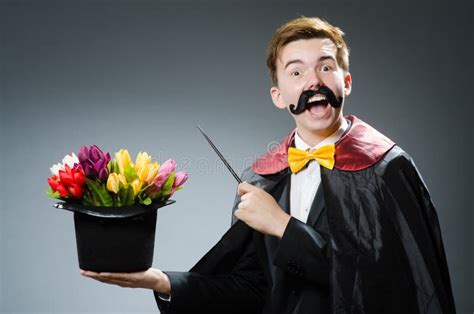 Funny magician with wand stock photo. Image of circus - 44750132