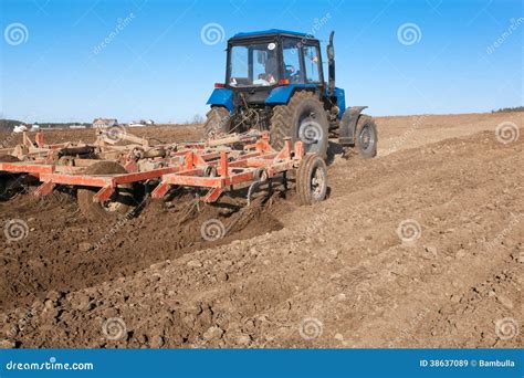 Tractor cultivating soil stock image. Image of farm, crop - 38637089