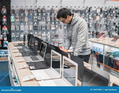 Modern Male Customer Choosing Laptop in the Computer Store Stock Image ...