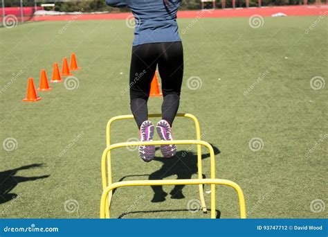 Jumping Over Hurdles during Practice Stock Photo - Image of flexibility, cones: 93747712